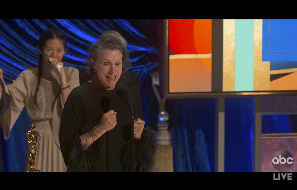 In this video image provided by ABC, Frances McDormand accepts the best picture award for "Nomadland" as director Chloe Zhao looks on at the Oscars on Sunday, April 25, 2021. (ABC via AP)