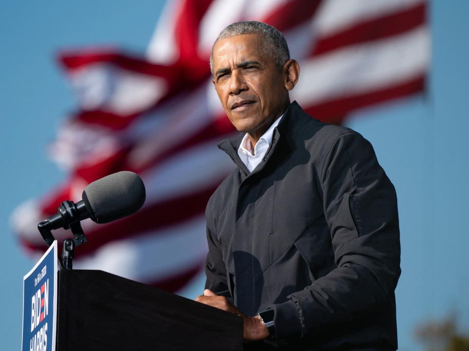 Barack Obama speaks at a Get Out the Vote rally as he campaigns for Democratic presidential candidate former Vice President Joe Biden in Atlanta, Georgia on 2 November 2020 (AFP via Getty Images)