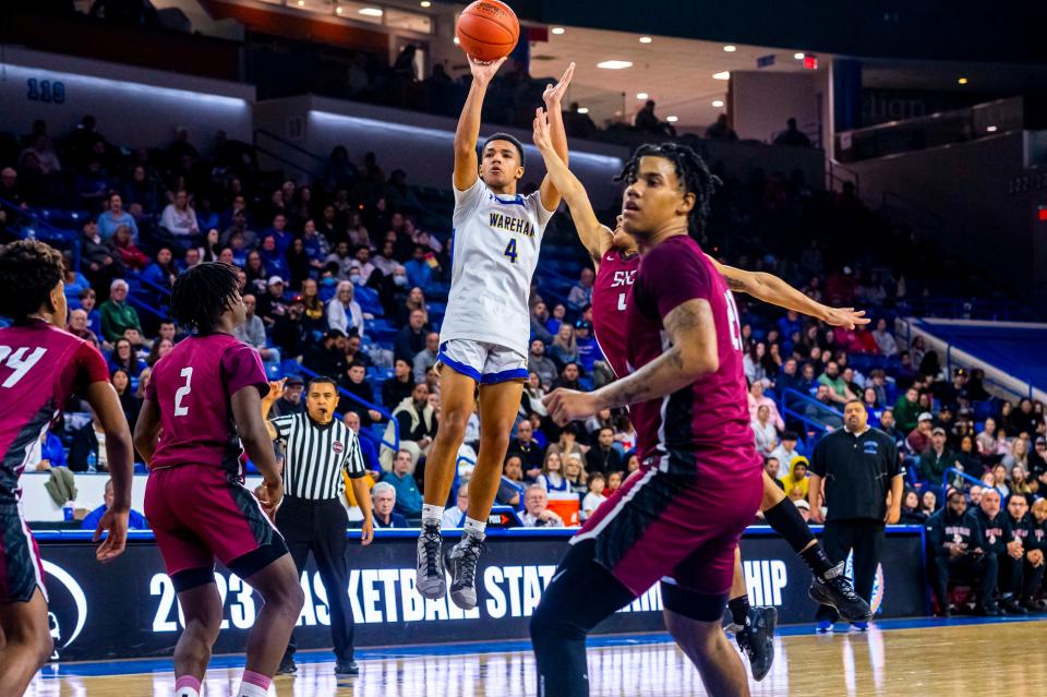 Wareham's Ajay Lopes pulls up for the mid range jumper.