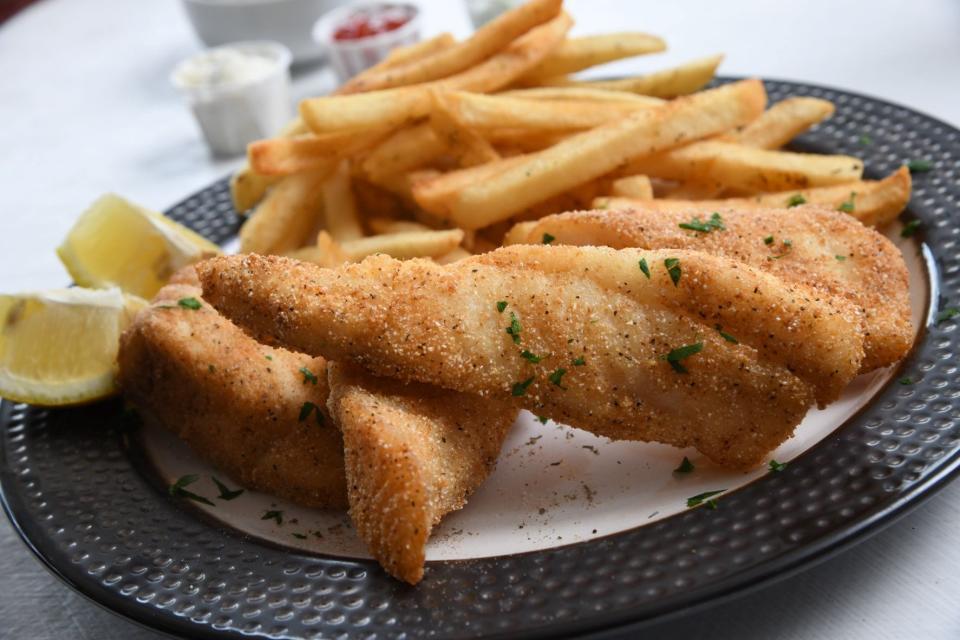 Green River Style North Atlantic Cod with seasoned fries, Mean Marys coleslaw, and jalapeno tartar sauce at The Fish House/Cafe Beignet in Louisville.