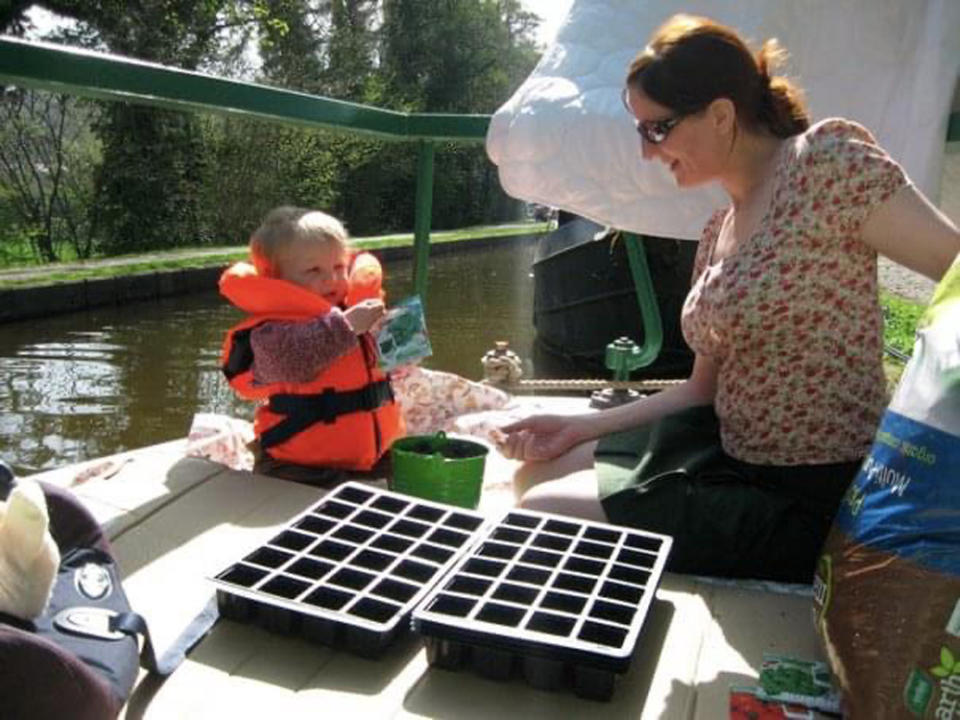 Zoe planting seeds with her daughter on the narrowboat (Collect/PA Real Life)