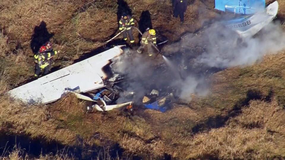 Video from Chopper 7 showed firefighters putting out flames amid the wreckage and plane parts and debris scattered across the field.