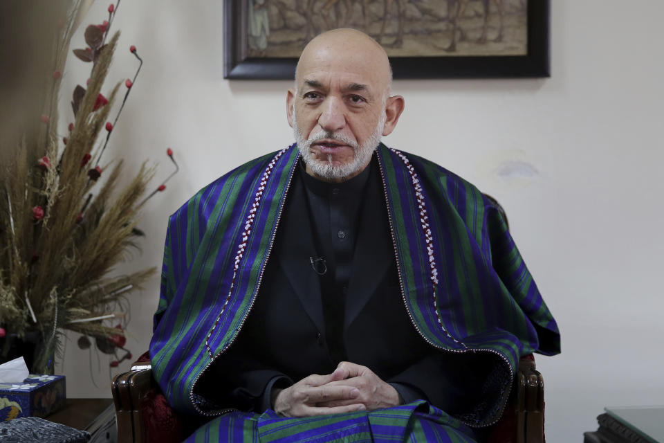 Former Afghan President Hamid Karzai speaks during an interview with The Associated Press, in Kabul, Afghanistan, Tuesday, Dec. 10, 2019. Karzai, whose final years in power were characterized by a cantankerous relationship with the United States, said on Tuesday that Washington used blackmail and corruption to manipulate his officials, undermine his government and foment violence among the country's many factions. (AP Photo/Altaf Qadri)