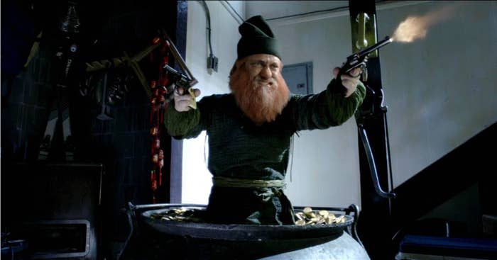 A leprechaun in a pot of gold dual-wields pistols