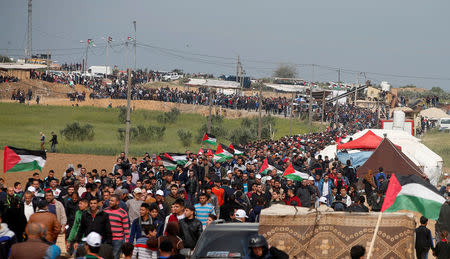 Palestinians attend a tent city protest along the Israel border with Gaza, March 30. REUTERS/Mohammed Salem