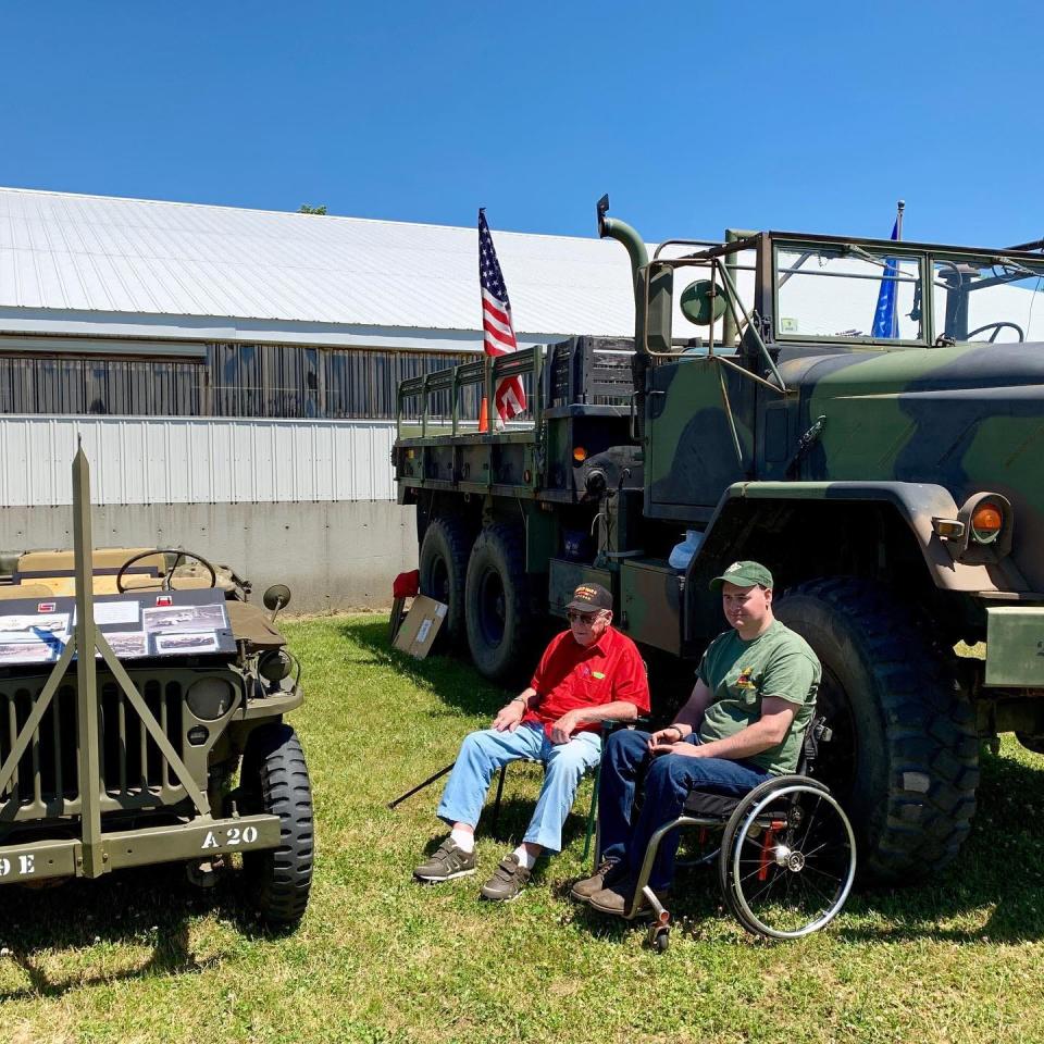 Chris Higgins beside his grandfather Kim Packard. They drove in the Spencer parade in 2019 to celebrate the 100th anniversary of the American Legion. Packard rode in the Jeep and Higgins followed in this 5-ton truck. He rigged up an overhead winch to lift him into it and installed hand controls to drive it.