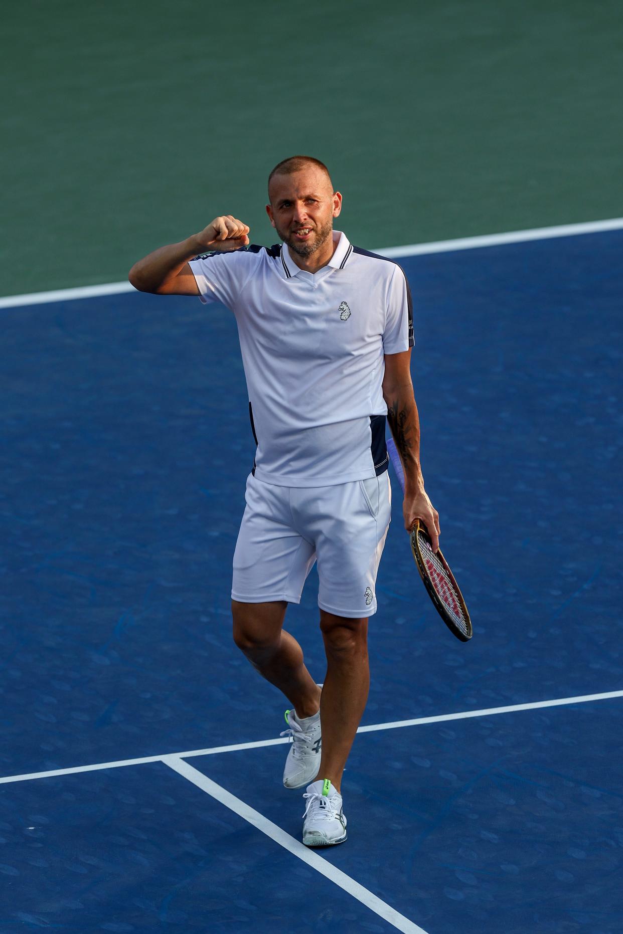 Dan Evans celebrates after defeating Karen Khachanov at the US Open.