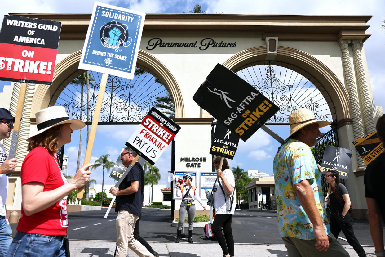Striking members of WGA and SAG-AFTRA picket in Los Angeles (Mario Tama / Getty Images)