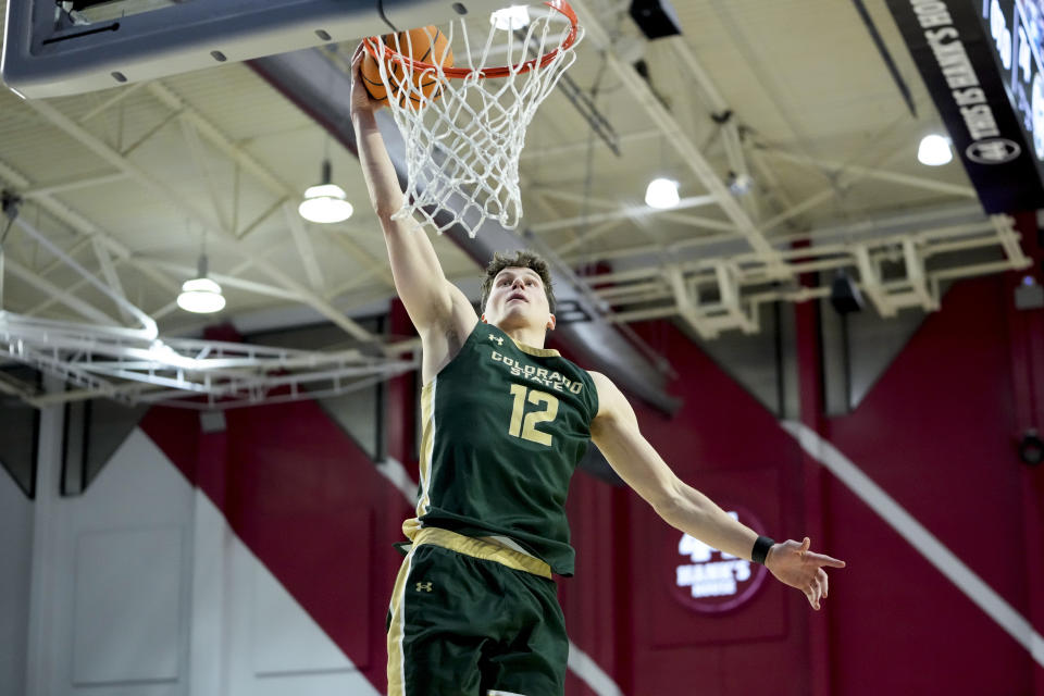 Colorado State forward Patrick Cartier dunks against Loyola Marymount during the second half of an NCAA college basketball game Friday, Dec. 22, 2023, in Los Angeles. (AP Photo/Ryan Sun)