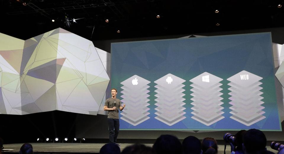 Facebook CEO Mark Zuckerberg gestures while delivering the keynote address at the f8 Facebook Developer Conference Wednesday, April 30, 2014, in San Francisco. (AP Photo/Ben Margot)