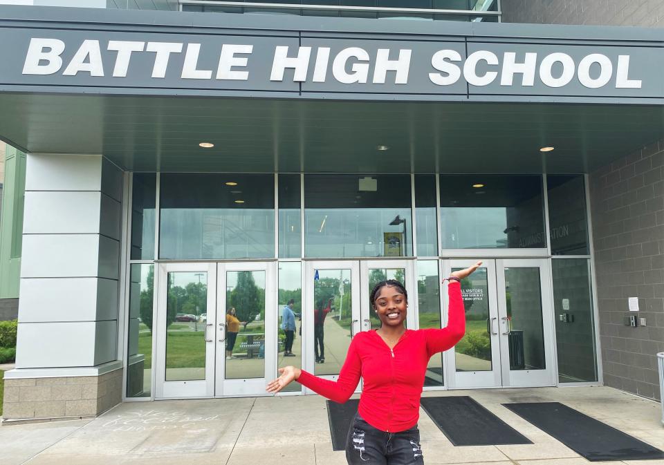Jearlissia Jackson, 17, poses Monday in front of Battle High School. She will graduate Saturday after participating in Spartan Academy.