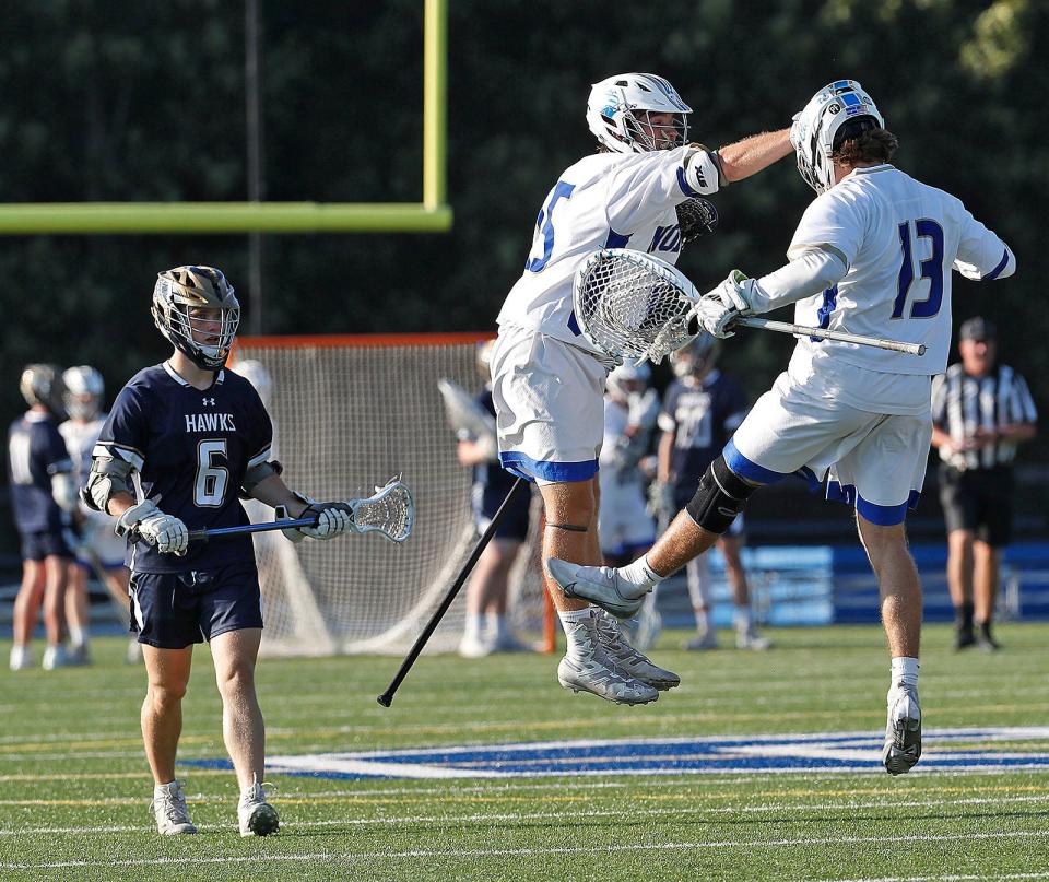 Norwell Jack Coyle and Ryan Daly celebrate a goal against Hanover in the MIAA Division 3 semifinals on Friday, June 17, 2022.
