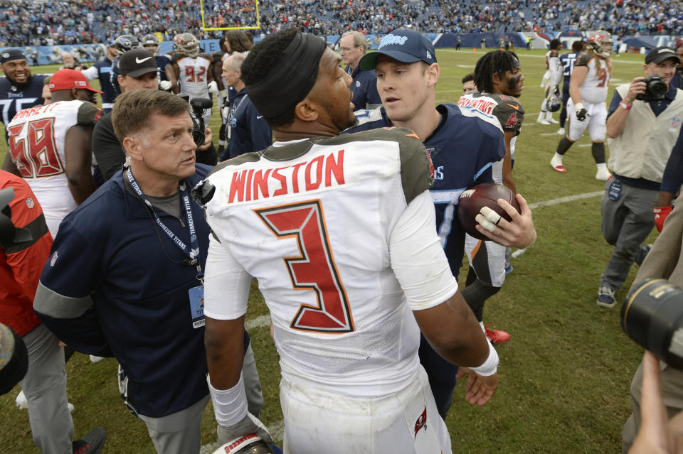 Tampa Bay Buccaneers quarterback Jameis Winston (3) talks with Tennessee Titans quarterback Ryan Tannehill after an NFL football game Sunday, Oct. 27, 2019, in Nashville, Tenn. The Titans won 27-23. (AP Photo/Mark Zaleski)