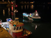 French fishing boats leave the Carteret harbour, north-western France, to take part in a protest off the English Channel island of Jersey, Thursday, May 6, 2021. French fishermen angry over loss of access to waters off their coast gathered their boats in protest Thursday off the English Channel island of Jersey, the flashpoint for the first major dispute between France and Britain over fishing rights in the wake of Brexit. (AP Photo)