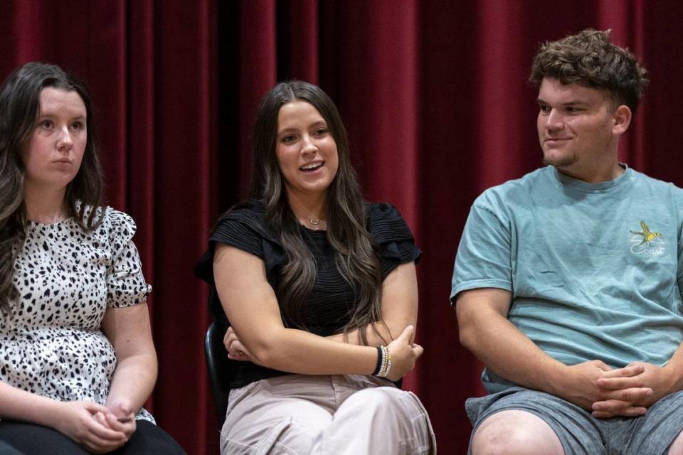 Recent Harlan County High School graduates Lesleigh Brown, from left, Jenna Wilson and William Cassim are photographed at the school in Harlan, Ky., on Wednesday, May 8, 2024.