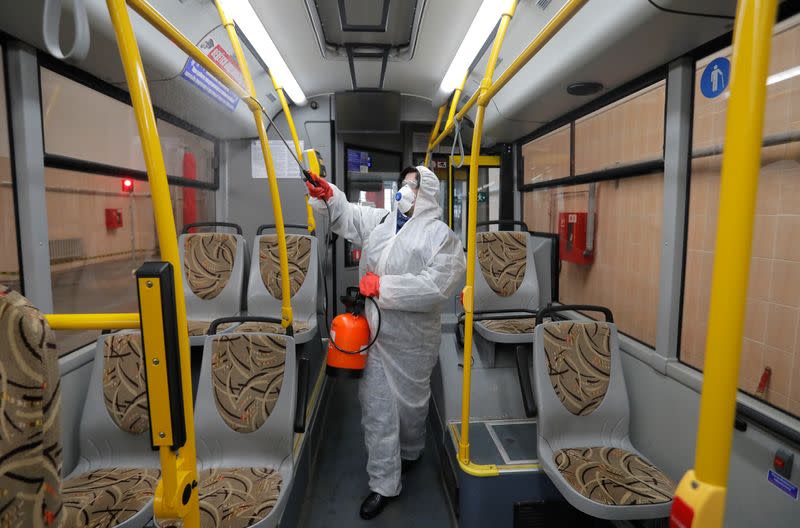An employee disinfects public transport in Minsk