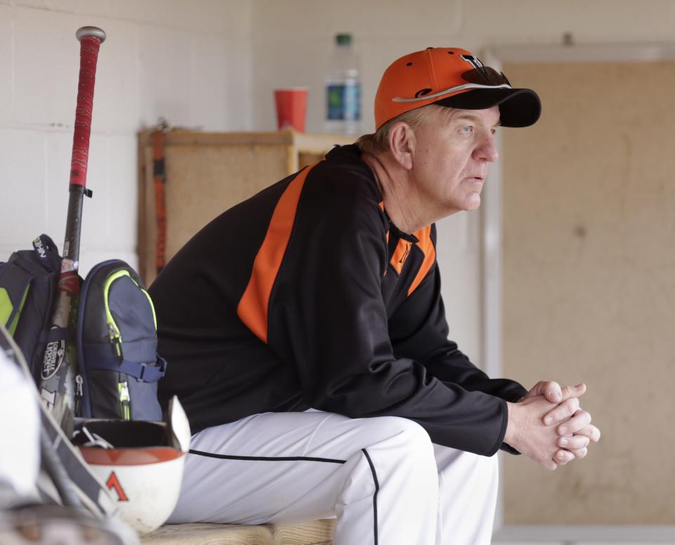 Jeff Hite sits in the dugout during his run as Hoover High School baseball coach.