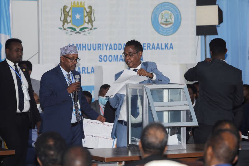 Officials count ballots during the first round of the Somali presidential elections, in Mogadishu