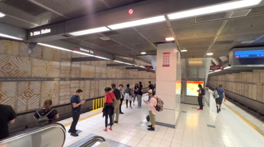 Riders wait for a subway ride at the Universal City/Studio City Metro Station. (KTLA)