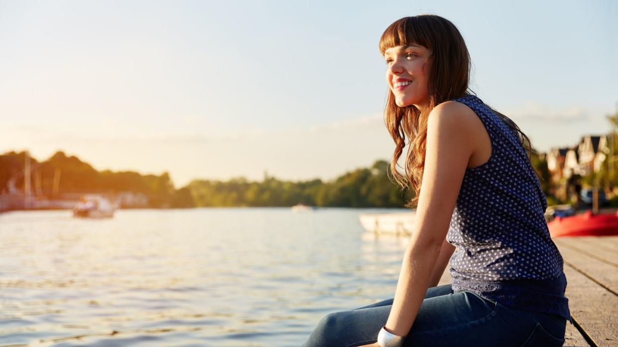 a person sitting on a dock