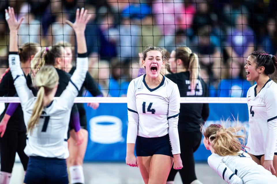 Pleasant Valley's Chloe Cline (14) celebrates a point with teammates during a Class 5A state volleyball championship match