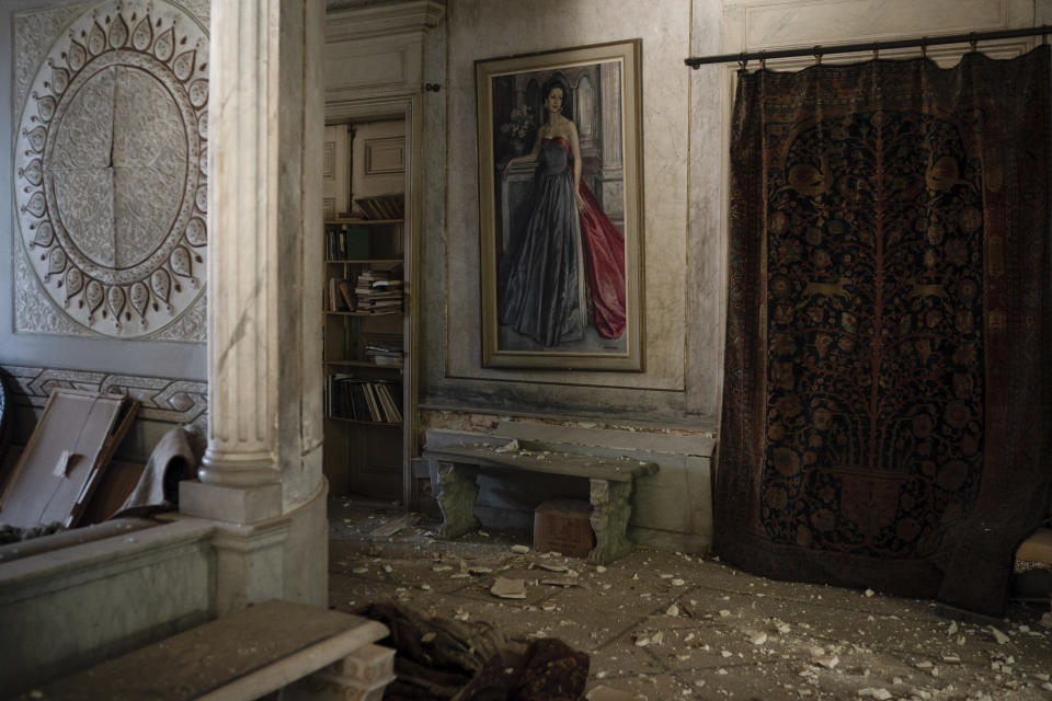 Debris from the ceiling and walls cover the floor of a room in the Sursock Palace, heavily damaged after the explosion in the seaport of Beirut, Lebanon, Friday, Aug. 7, 2020. The 150-year-old palace withstood two world wars, the fall of the Ottoman empire, the French mandate and Lebanese independence. After the country's 1975-1990 civil war, it took 20 years of careful restoration for the family to bring the palace back to its former glory. (AP Photo/Felipe Dana)