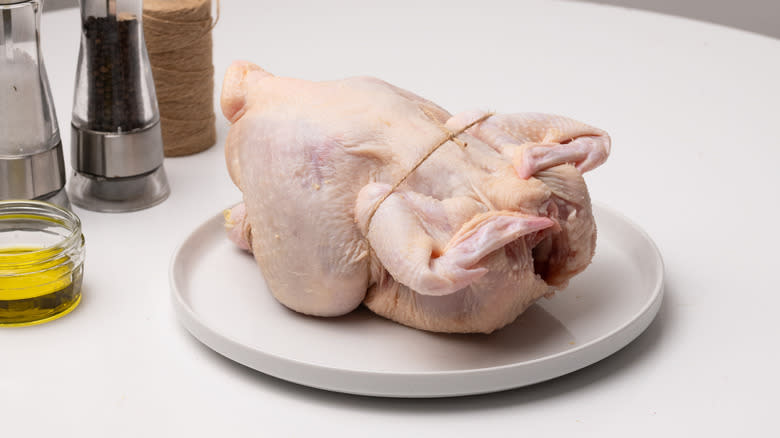 chicken being tied with twine