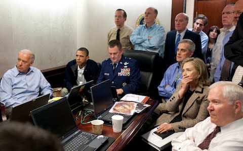 Secretary of State Hillary Rodham Clinton, President Barack Obama and Vice President Joe Biden, along with with members of the national security team, receive an update on the mission against Osama bin Laden in the Situation Room of the White House - Credit: AP