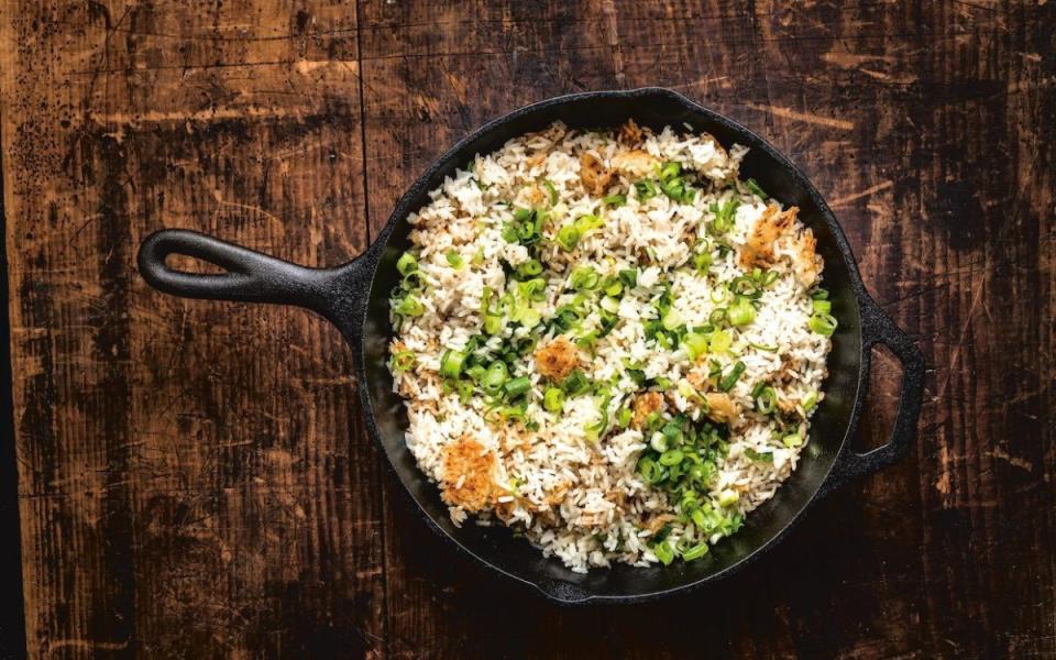 <p>Ed Anderson</p><p>This simple, addictive crispy rice helped celebrity chef Bobby Flay win a throwdown on <em>Beat Bobby Flay</em>. Get the recipe for Flay's <strong><a href="https://parade.com/903147/parade/bobby-flay-crispy-coconut-scallion-rice-recipe/" rel="nofollow noopener" target="_blank" data-ylk="slk:Crispy Coconut Scallion Rice;elm:context_link;itc:0;sec:content-canvas" class="link ">Crispy Coconut Scallion Rice</a></strong>.</p>