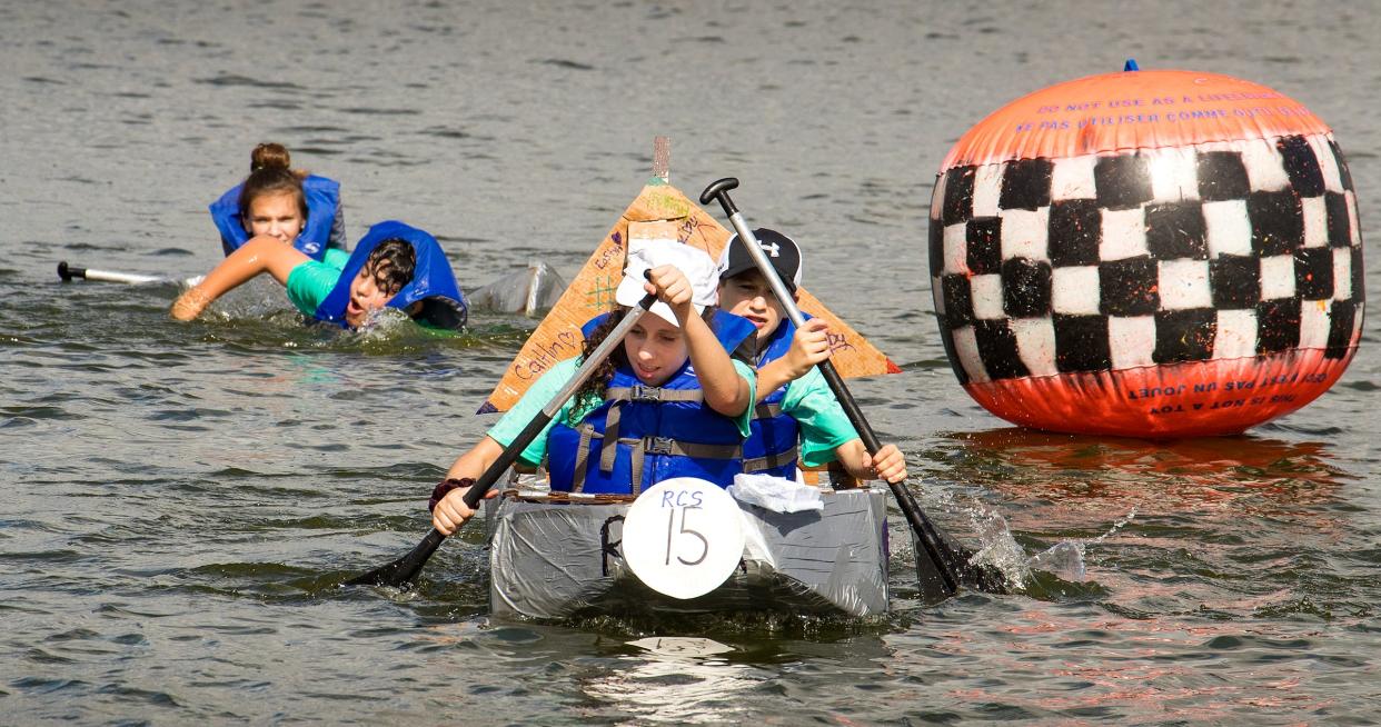 The 18th annual Lakeland Cardboard Boat Challenge sponsored by the Lakes Education/Action Drive will be held Oct. 14 at Lake Hollingsworth Board Ramp. This photo shows a team rounding a buoy on the course in October 2018 as another boat sinks.