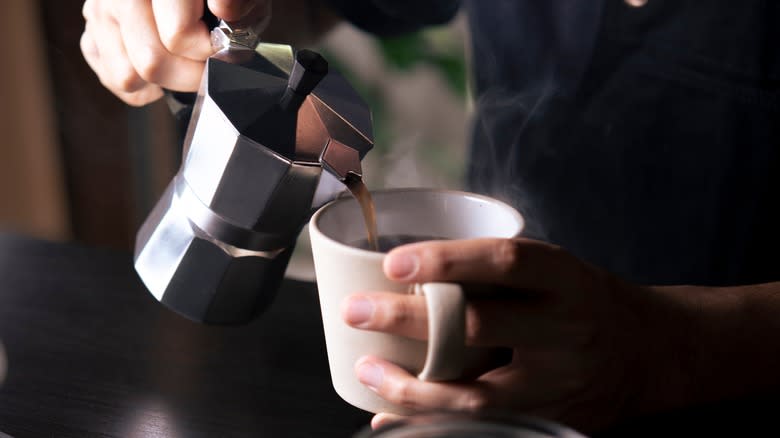 pouring coffee from moka pot