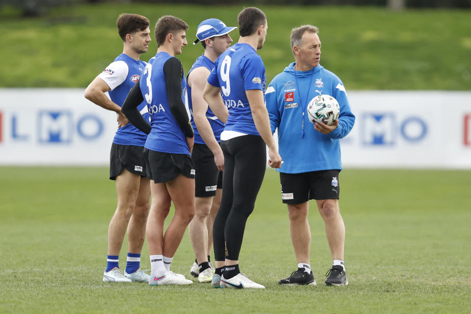 MELBOURNE, AUSTRALIA - AUGUST 04: Alastair Clarkson, North Melbourne Senior coach gives instruction on the training track before a North Melbourne Kangaroos AFL Media Opportunity at Arden Street Ground on August 04, 2023 in Melbourne, Australia. (Photo by Darrian Traynor/Getty Images)
