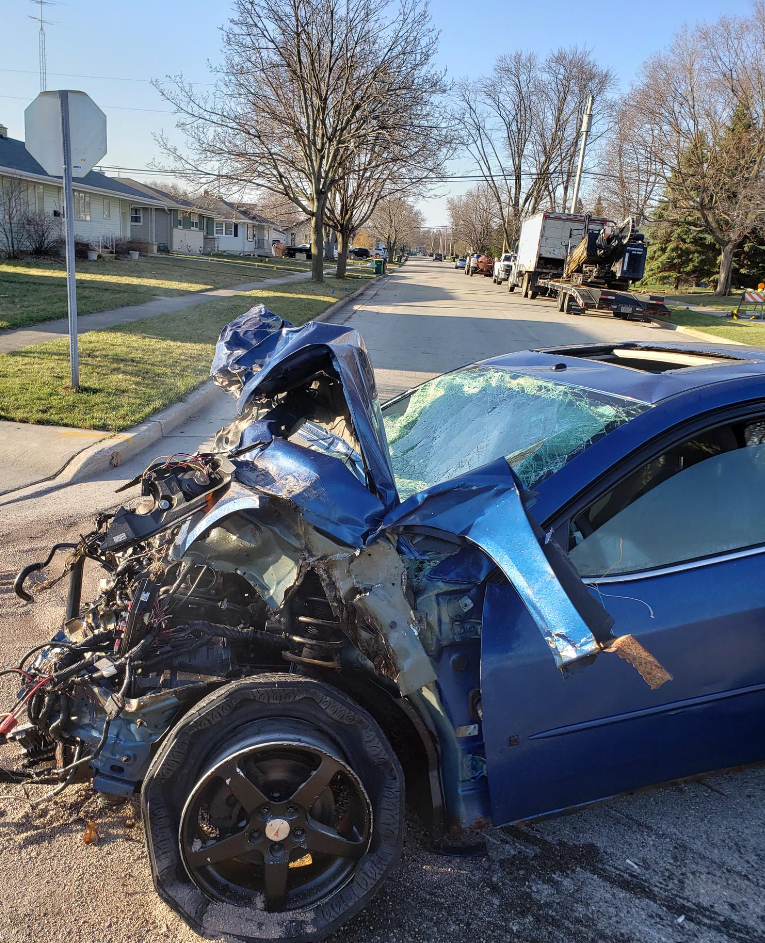 This scene from a Wednesday morning accident shows a car allegedly involved in multiple crashes in a residential area in Fond du Lac.