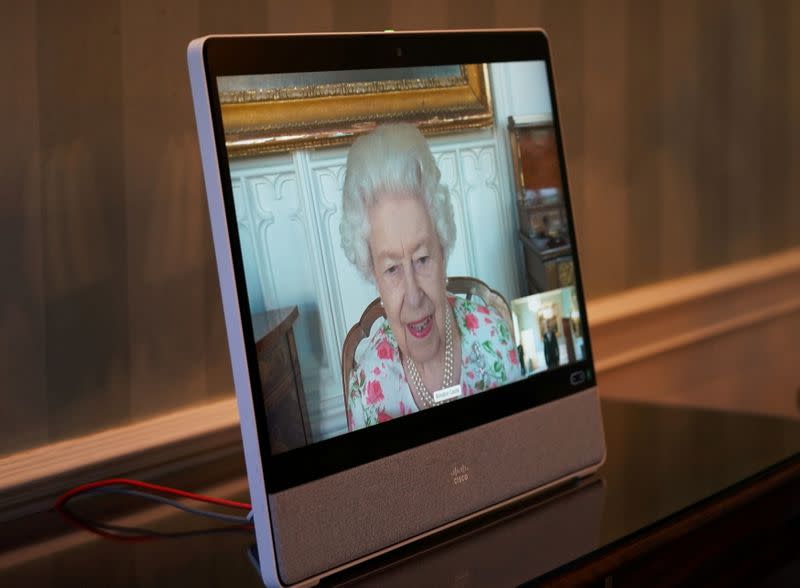 FILE PHOTO: Britain's Queen Elizabeth II appears on a screen via videolink from Windsor Castle, where she is in residence, during a virtual audience to receive His Excellency Dr Zalmai Rassoul, Ambassador from the Islamic Republic of Afghanistan, at Buckin