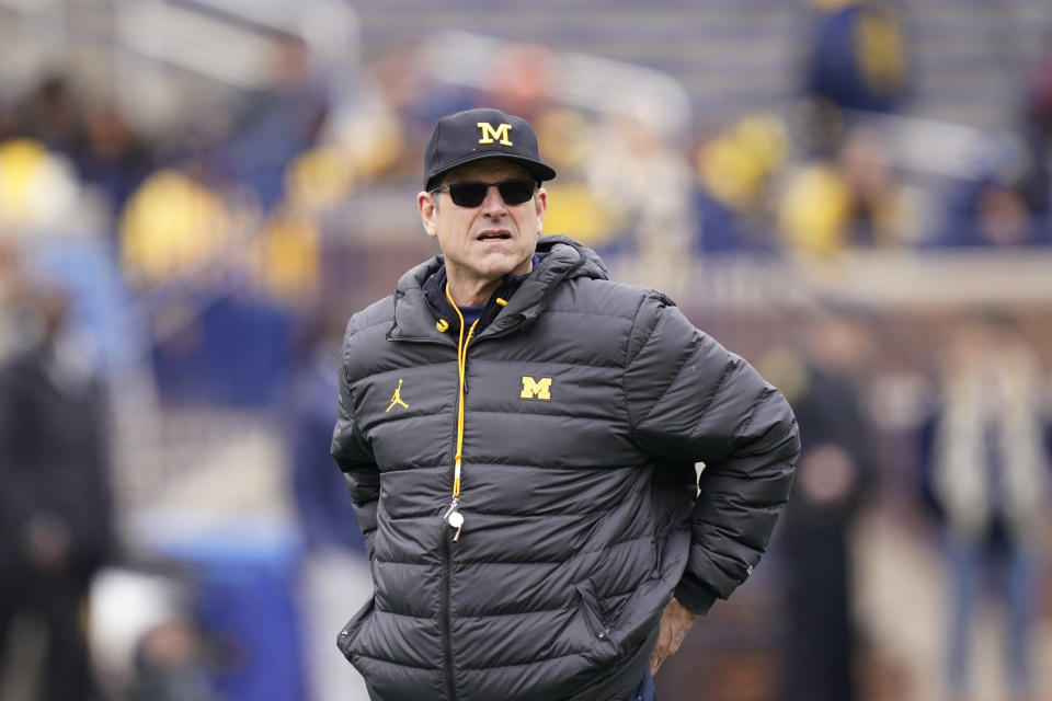 FILE - Michigan head football coach Jim Harbaugh watches an NCAA college football intrasquad spring game April 2, 2022, in Ann Arbor, Mich. Harbaugh’s eighth team is his first at Michigan that is coming off a win over Ohio State. The eighth-ranked Wolverines’ new challenge is to beat the Buckeyes on the road for the first time since 2000. (AP Photo/Carlos Osorio, File)