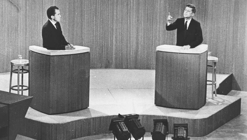 Republican Vice President Richard M. Nixon, listens as Sen. John F. Kennedy, the Democratic presidential nominee, makes a point during a live broadcast from a New York television studio of their fourth presidential debate on Oct. 21, 1960.