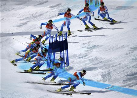 Finland's Samu Torsti clears a gate during the second run of the men's alpine skiing giant slalom event at the 2014 Sochi Winter Olympics at the Rosa Khutor Alpine Center February 19, 2014. REUTERS/Dominic Ebenbichler