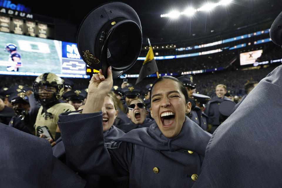 Army Cadets storm the field after defeating the Navy in an NCAA college football game at Gillette Stadium Saturday, Dec. 9, 2023, in Foxborough, Mass. (AP Photo/Winslow Townson)