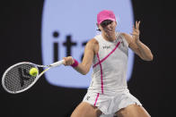 Iga Swiatek, of Poland, returns a shot from Ekaterina Alexandrova, of Russia, during the Miami Open tennis tournament, Monday, March 25, 2024, in Miami Gardens, Fla. (AP Photo/Wilfredo Lee)