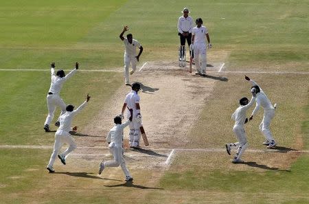 Cricket - India v England - Second Test cricket match - Dr. Y.S. Rajasekhara Reddy ACA-VDCA Cricket Stadium, Visakhapatnam, India - 21/11/16. India's Ravichandran Ashwin celebrates with teammates the dismissal of England's Ben Duckett. REUTERS/Danish Siddiqui