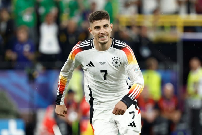Kai Havertz scored a penalty to set host nation <a class="link " href="https://sports.yahoo.com/soccer/teams/germany-women/" data-i13n="sec:content-canvas;subsec:anchor_text;elm:context_link" data-ylk="slk:Germany;sec:content-canvas;subsec:anchor_text;elm:context_link;itc:0">Germany</a> on their way to a 2-0 win over <a class="link " href="https://sports.yahoo.com/soccer/teams/denmark-women/" data-i13n="sec:content-canvas;subsec:anchor_text;elm:context_link" data-ylk="slk:Denmark;sec:content-canvas;subsec:anchor_text;elm:context_link;itc:0">Denmark</a> that saw them march into the Euro 2024 quarter-finals (KENZO TRIBOUILLARD)