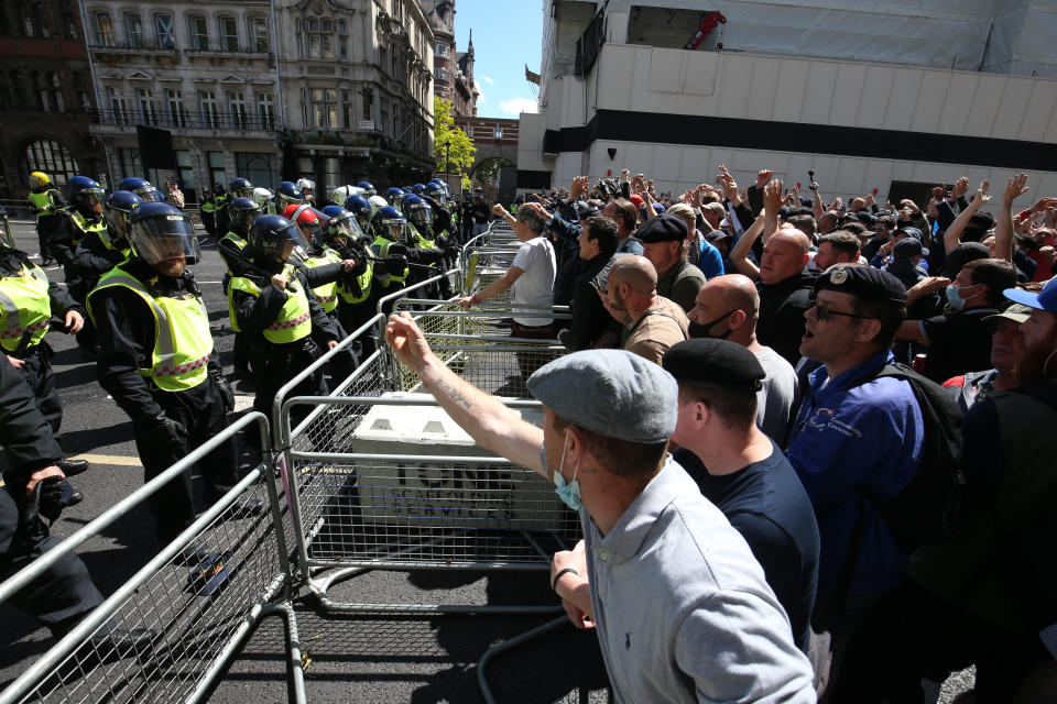 Police are confronted by protesters in Whitehall near Parliament Square, London, during a protest by the Democratic Football Lads Alliance against a Black Lives Matter protest.