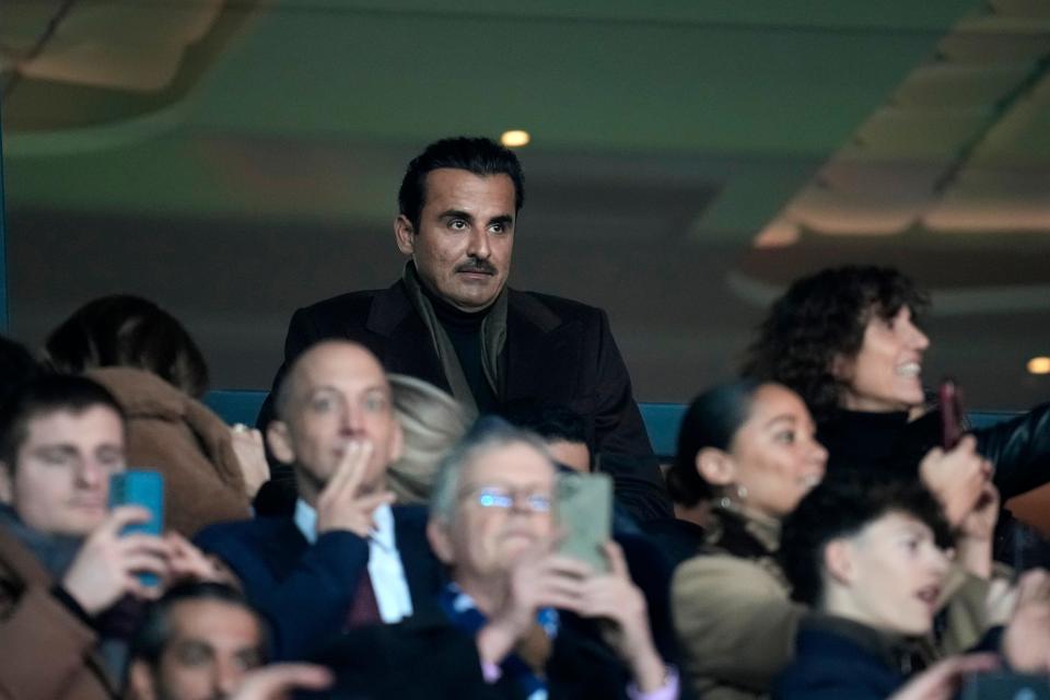 The Emir of Qatar Sheikh Tamim bin Hamad al-Thani has not threatened to cut off the nation's gas supply to the world. In this photo, al-Thani, center, watches a Champions League soccer match in Paris on Feb. 14.