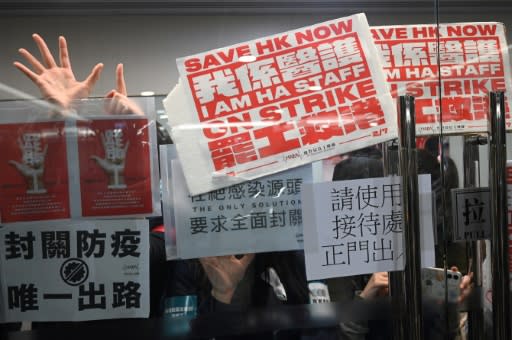 Striking medical workers demand Hong Kong close the border with China to contain the virus