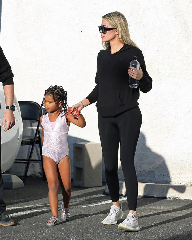 Khloe Kardashian Gets Comfy in Yeezy Sneakers With Daughter True in Pink  Leotard and Metallic Caged Sandals for Gymnastics Class