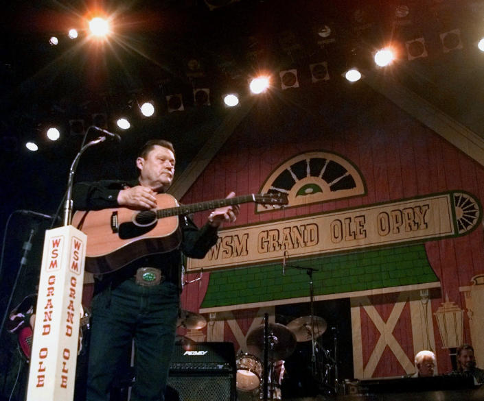 FILE - Country music veteran Stonewall Jackson performs on the stage of the Ryman Auditorium in Nashville, Tenn., as the Grand Ole Opry returns to its former home Jan. 15, 1999. Jackson, who sang on the Grand Ole Opry for more than 50 years and had No. 1 hits with “Waterloo” and others, died Saturday, Dec. 4, 2021, after a long battle with vascular dementia. He was 89. (AP Photo/Mark Humphrey, File)
