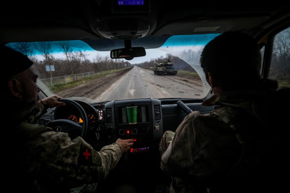 Volunteer medics from PDMSh (the first volunteer mobile hospital) evacuating a wounded Ukrainian soldier from a stabilising mobile hospital in the vicinity of Bakhmut, Donetsk region, amid the Russian invasion of Ukraine on Monday (AFP via Getty Images)