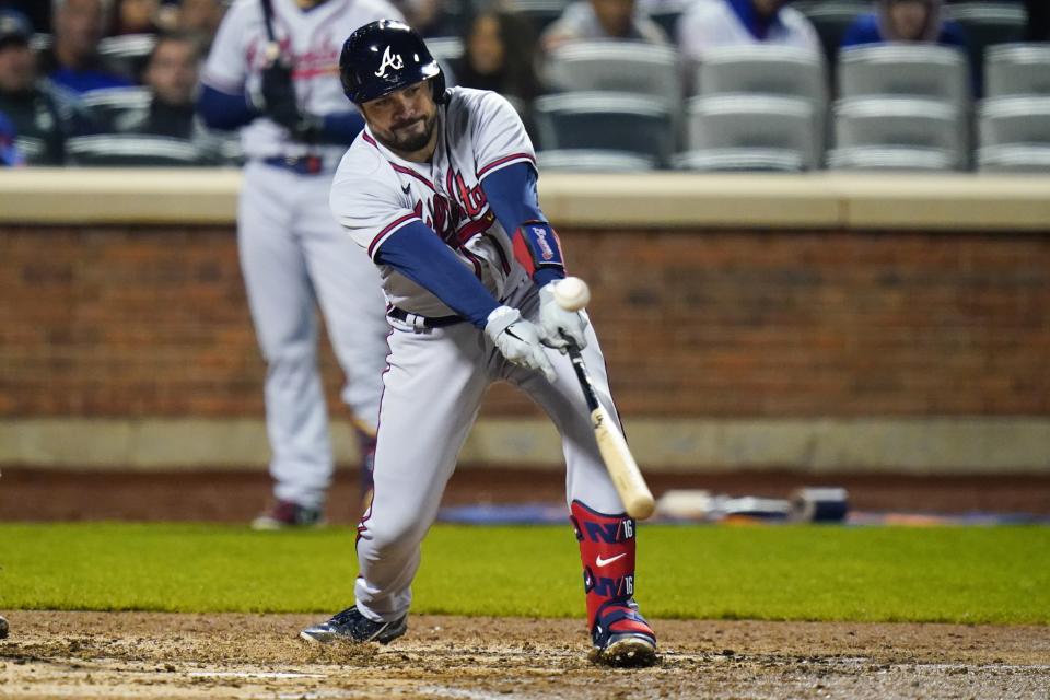 Atlanta Braves' Travis d'Arnaud hits an RBI-double during the sixth inning of a baseball game against the New York Mets, Monday, May 2, 2022, in New York. (AP Photo/Frank Franklin II)