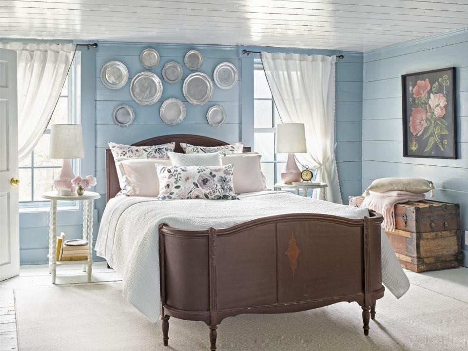 <p>You might be tempted to go with a crisp white in a cramped bedroom. You could do that. Or you could envelop the walls with a dreamy <a href="https://www.benjaminmoore.com/en-us/color-overview/find-your-color/color/hc-145/van-courtland-blue?color=HC-145" rel="nofollow noopener" target="_blank" data-ylk="slk:Van Courtland Blue by Benjamin Moore;elm:context_link;itc:0;sec:content-canvas" class="link ">Van Courtland Blue by Benjamin Moore</a> and wake up every morning in a very good mood. The choice is yours. </p>