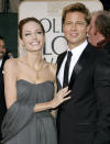 Actors Brad Pitt (R) and Angelina Jolie arrive at the 64th annual Golden Globe Awards in Beverly Hills, California January 15, 2007. REUTERS/Lucy Nicholson (UNITED STATES)